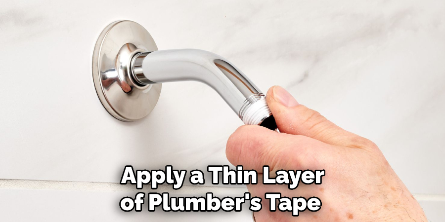  Apply a Thin Layer of Plumber's Tape
