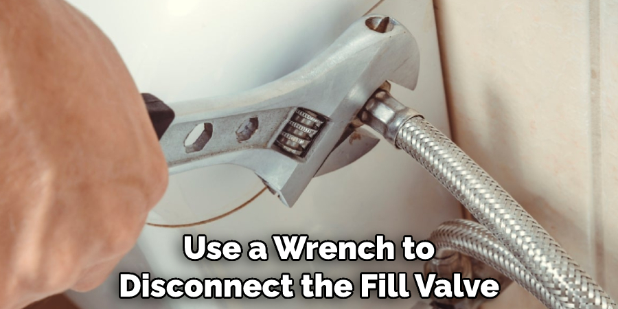 Use a Wrench to Disconnect the Fill Valve