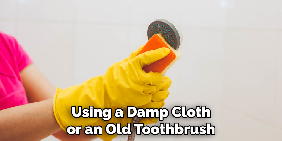 Using a Damp Cloth or an Old Toothbrush