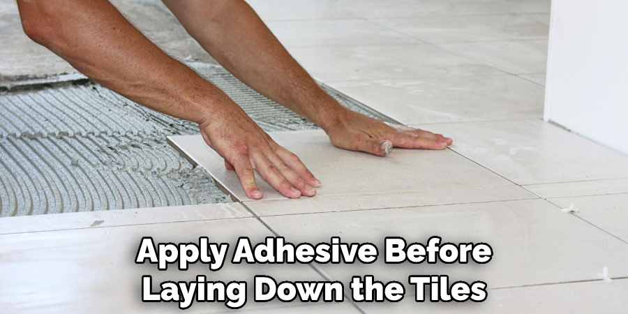 Apply Adhesive Before Laying Down the Tiles