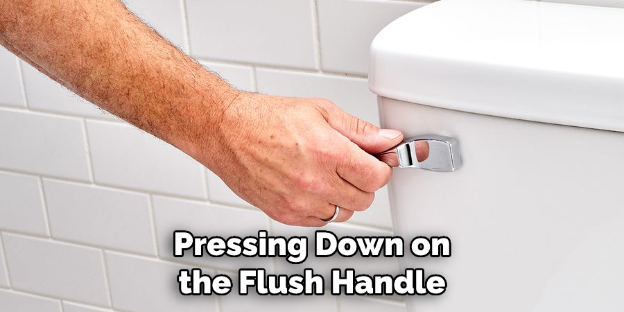 Pressing Down on the Flush Handle