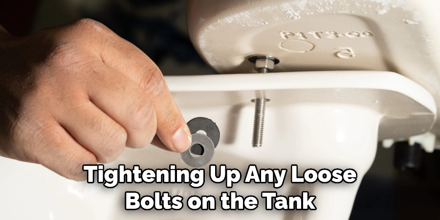 Tightening Up Any Loose Bolts on the Tank