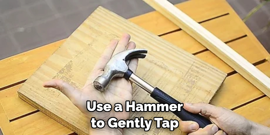 Use a Hammer to Gently Tap