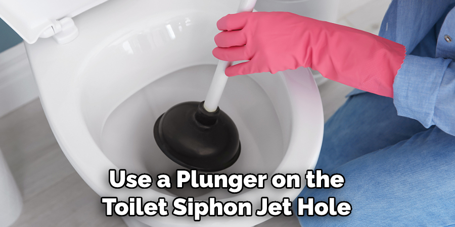 Use a Plunger on the Toilet Siphon Jet Hole