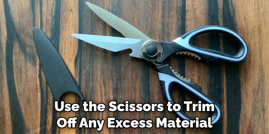 Use the Scissors to Trim Off Any Excess Material