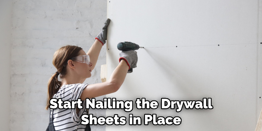 Start Nailing the Drywall Sheets in Place