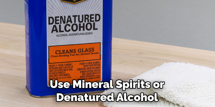 Use Mineral Spirits or Denatured Alcohol