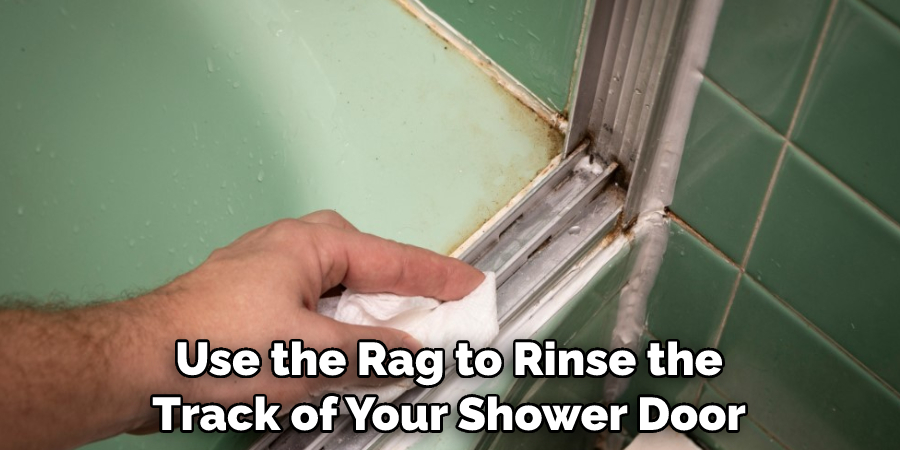 Use the Rag to Rinse the Track of Your Shower Door