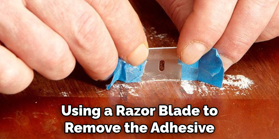 Using a Razor Blade to Remove the Adhesive