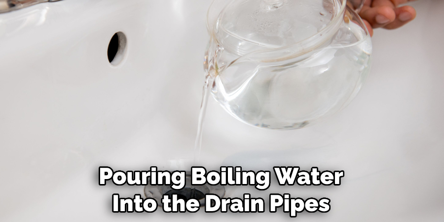 Pouring Boiling Water Into the Drain Pipes