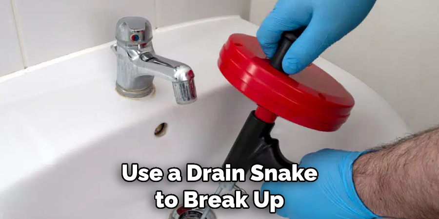 Use a Drain Snake to Break Up