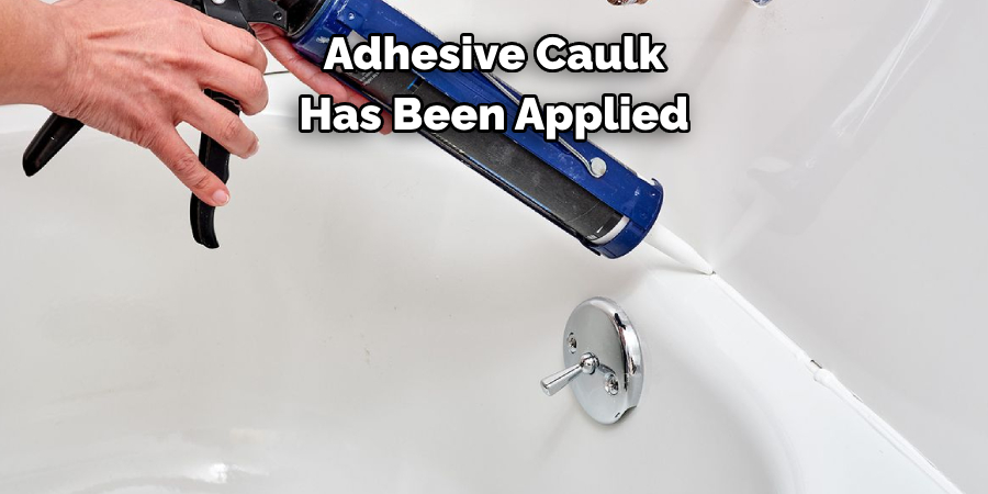 Adhesive Caulk 
Has Been Applied