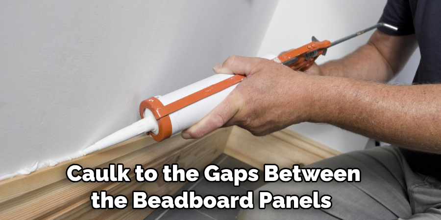 Caulk to the Gaps Between the Beadboard Panels