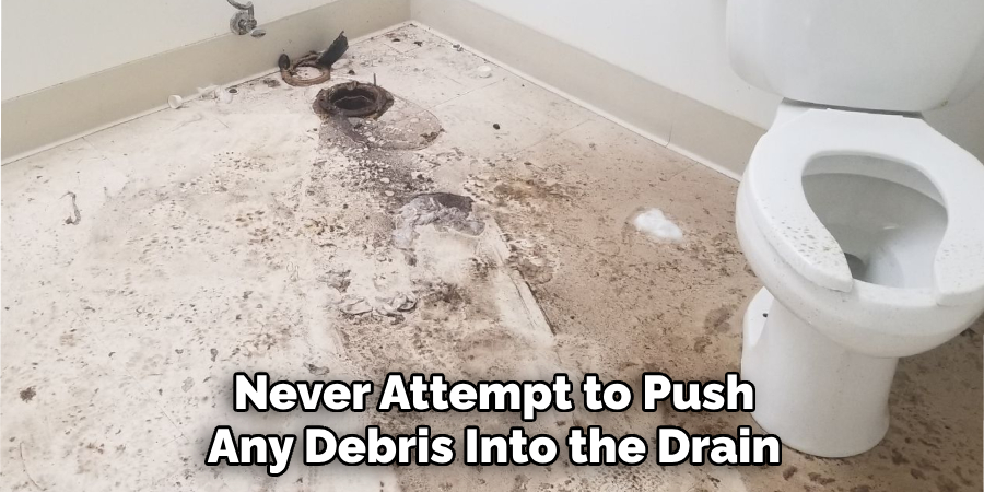 Never Attempt to Push Any Debris Into the Drain