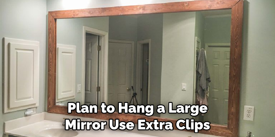 Plan to Hang a Large Mirror Use Extra Clips