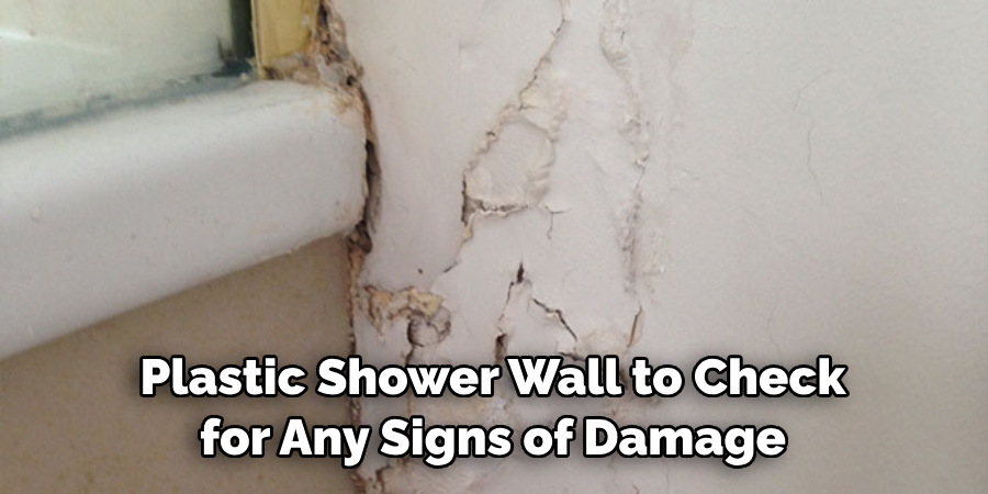 Plastic Shower Wall to Check for Any Signs of Damage
