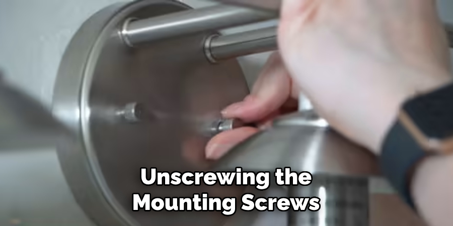 Unscrewing the Mounting Screws