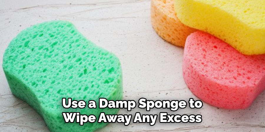 Use a Damp Sponge to Wipe Away Any Excess