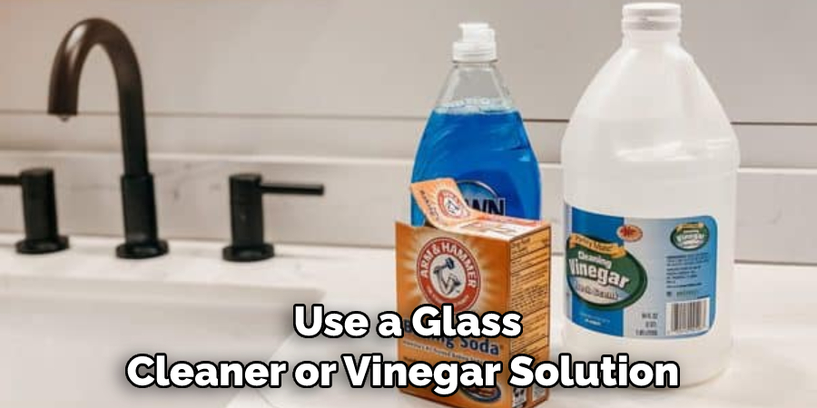 Use a Glass Cleaner or Vinegar Solution 