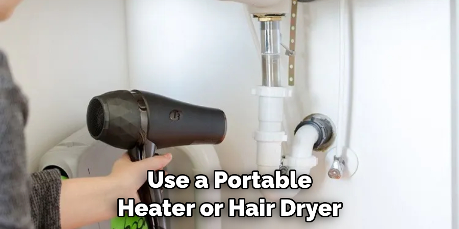 Use a Portable Heater or Hair Dryer