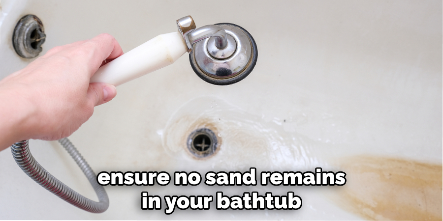 ensure no sand remains in your bathtub