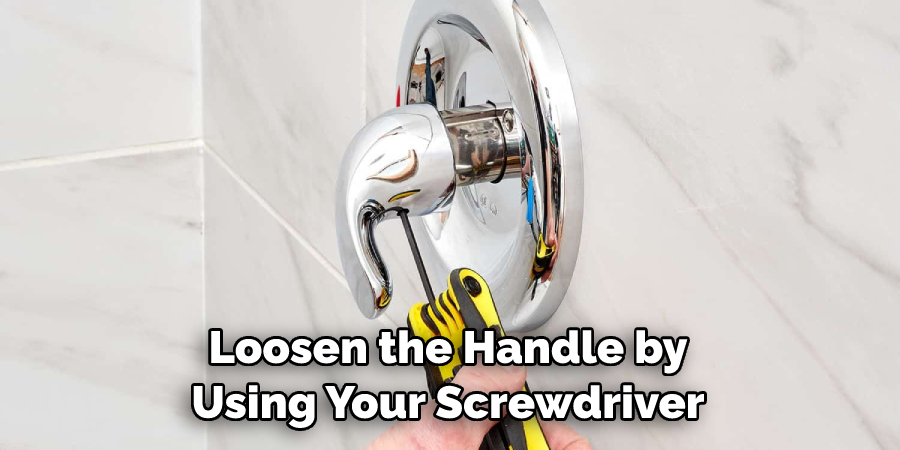 Loosen the Handle by Using Your Screwdriver