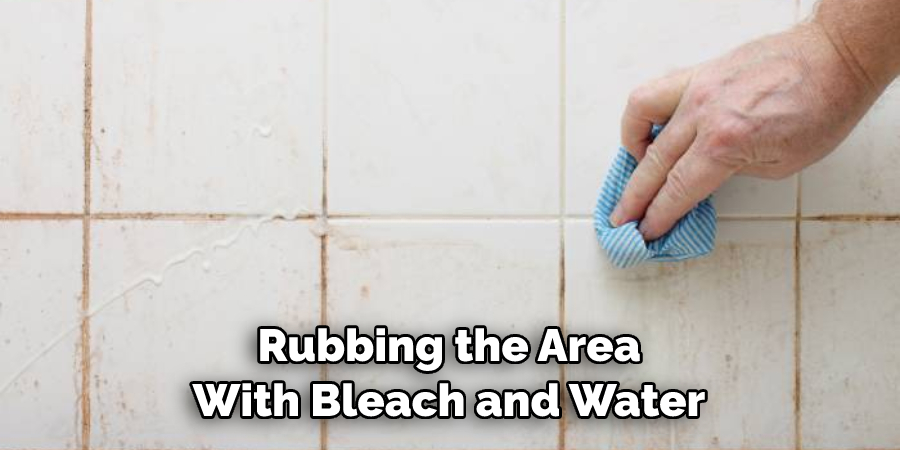 Rubbing the Area With Bleach and Water