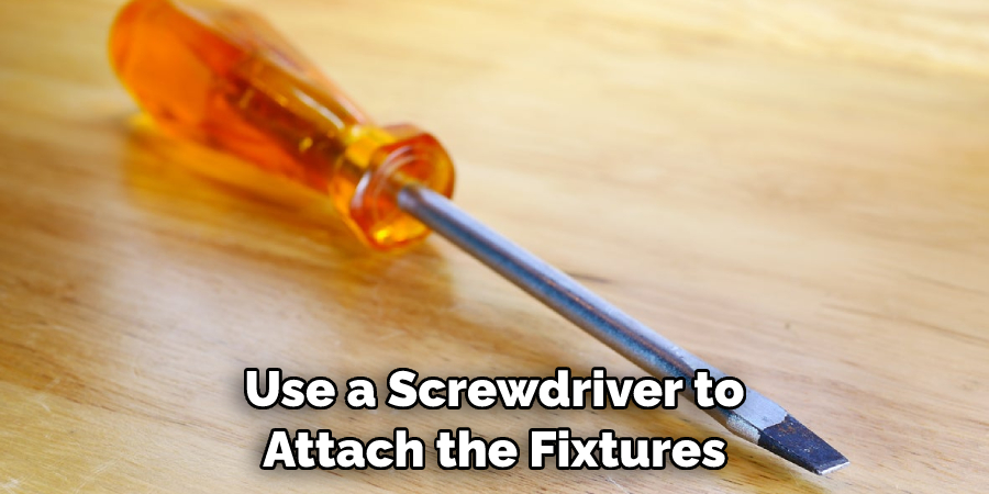 Use a Screwdriver to Attach the Fixtures