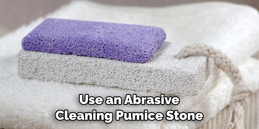 Use an Abrasive Cleaning Pumice Stone