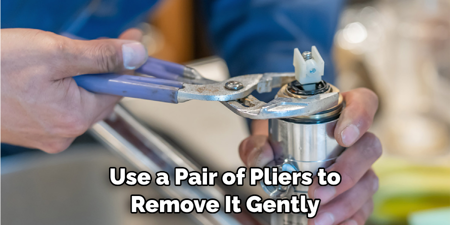 Use a Pair of Pliers to Remove It Gently