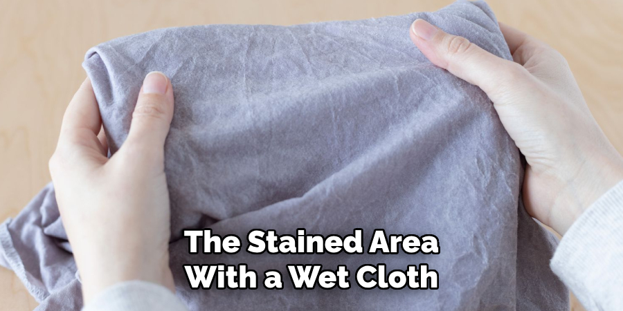 The Stained Area With a Wet Cloth