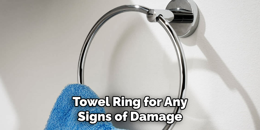 Towel Ring for Any Signs of Damage