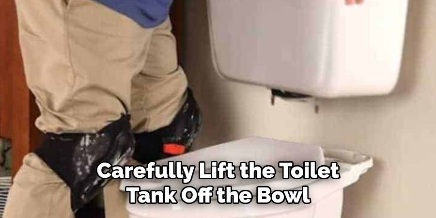 Carefully Lift the Toilet Tank Off the Bowl