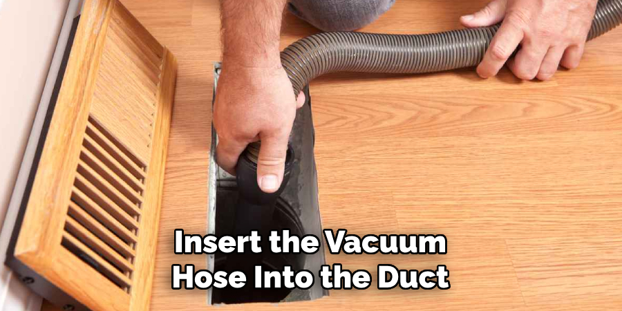 Insert the Vacuum Hose Into the Duct