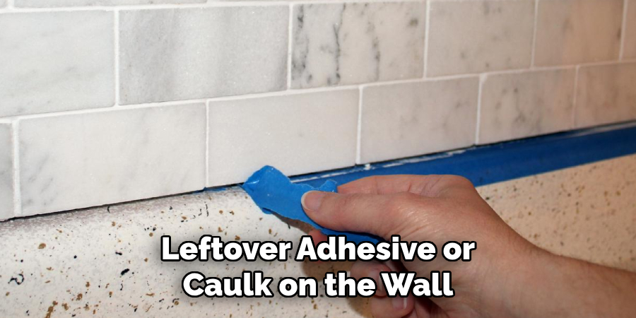 Leftover Adhesive or Caulk on the Wall