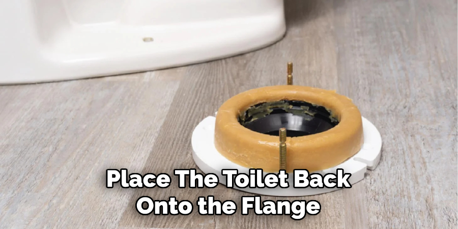 Place the Toilet Back Onto the Flange