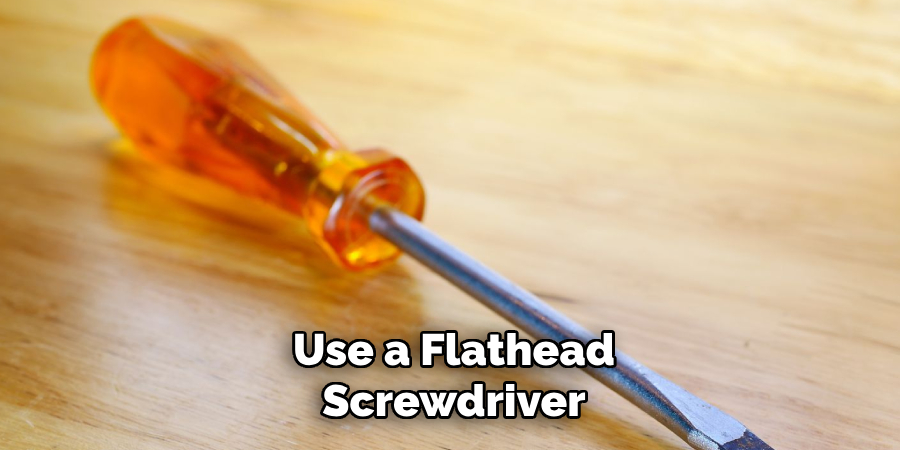 Use a Flathead Screwdriver