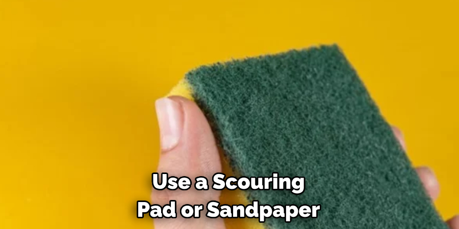 Use a Scouring Pad or Sandpaper