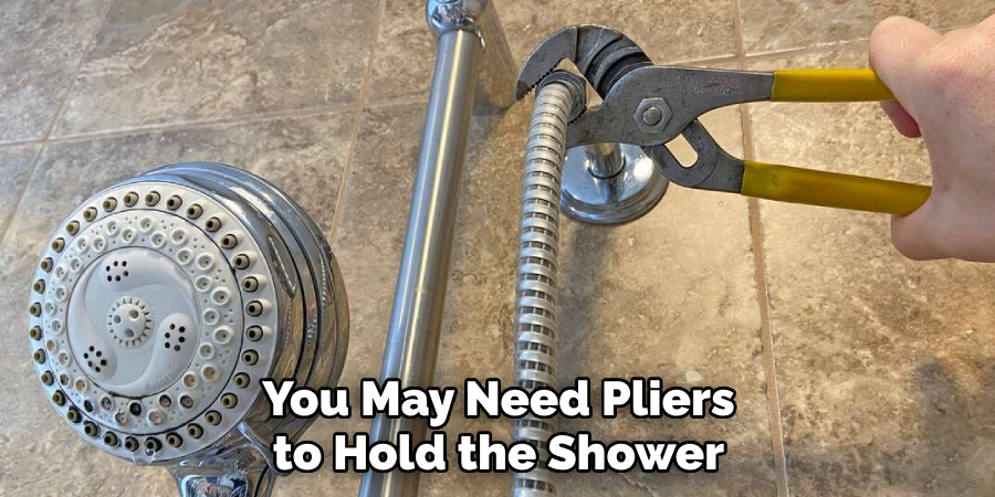 You May Need Pliers to Hold the Shower