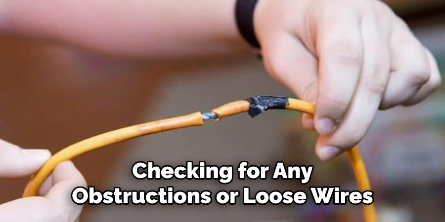 Checking for Any Obstructions or Loose Wires