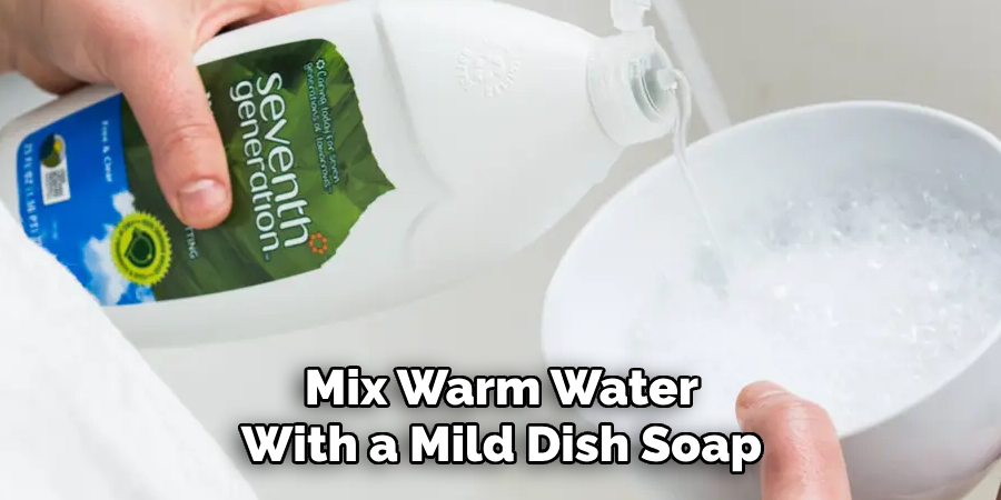 Mix Warm Water With a Mild Dish Soap