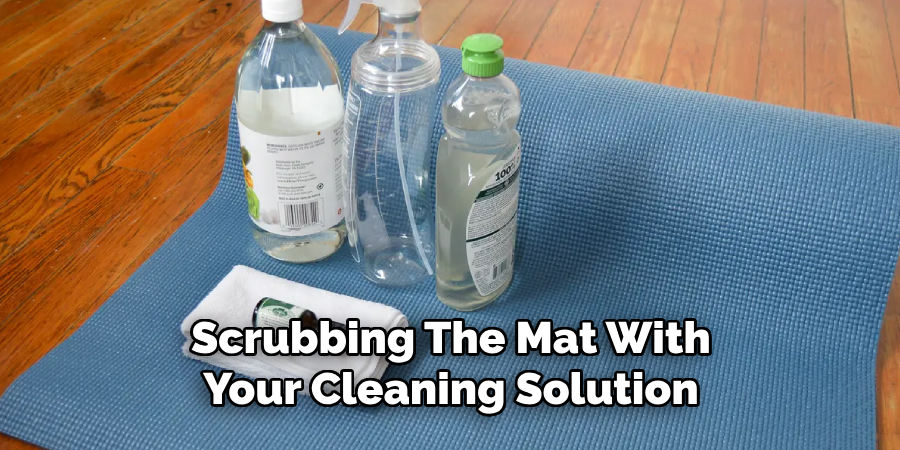 Scrubbing the Mat With Your Cleaning Solution