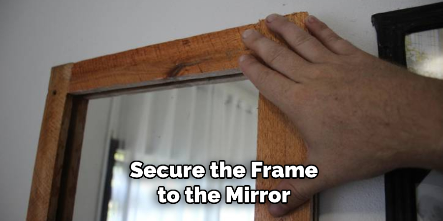 Secure the Frame to the Mirror