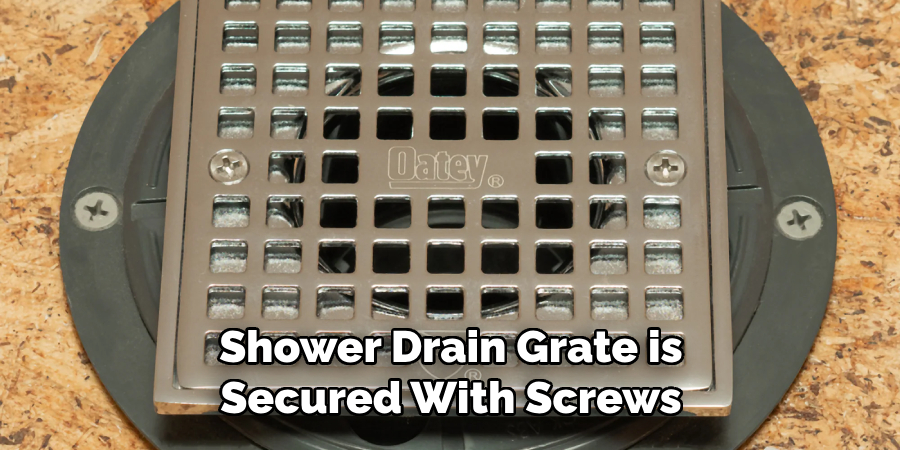Shower Drain Grate is Secured With Screws
