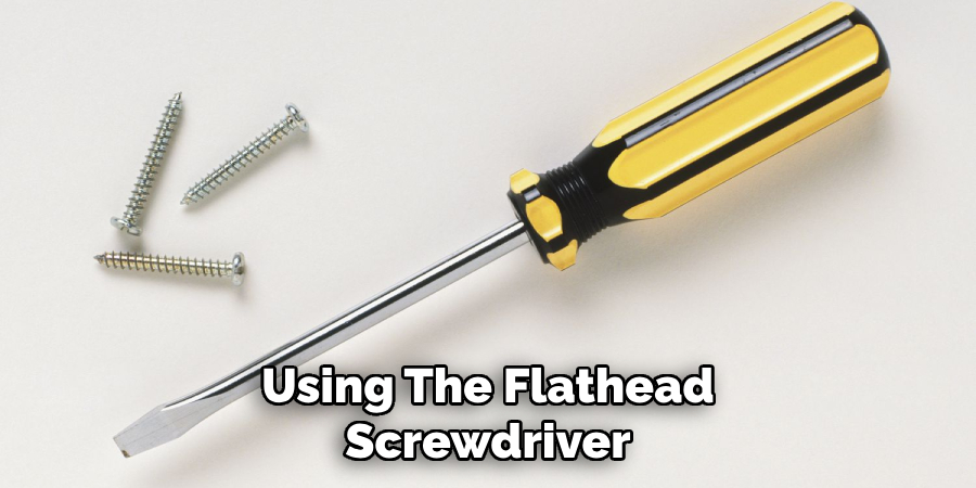 Using the Flathead Screwdriver
