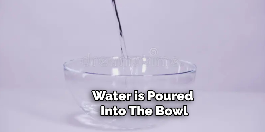 Water is Poured Into the Bowl