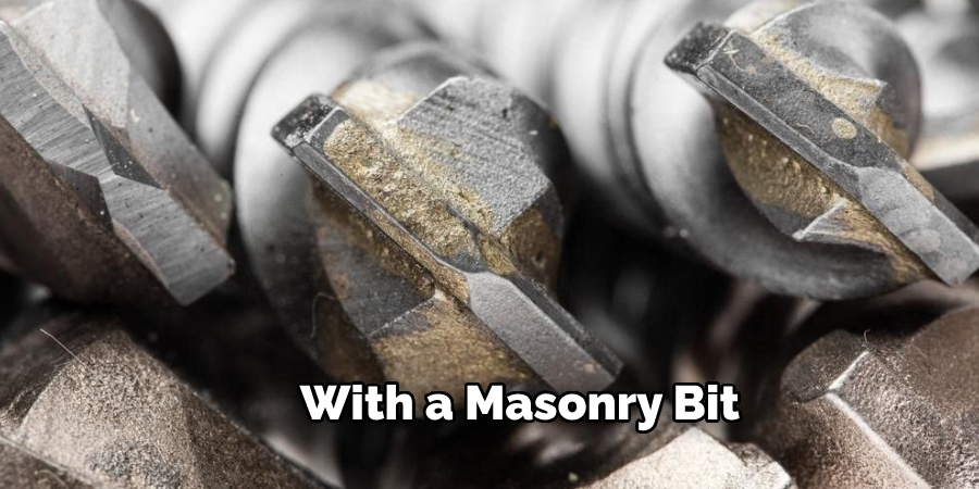 With a Masonry Bit