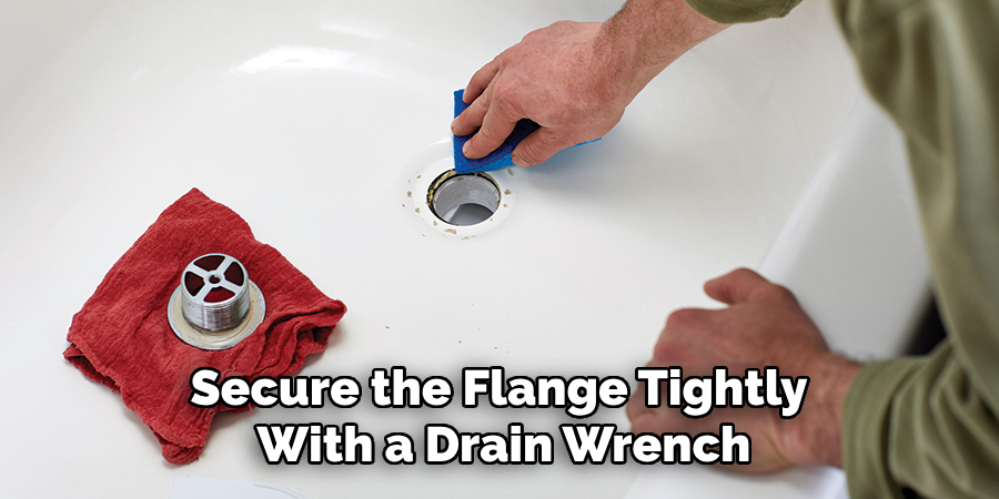 Secure the Flange Tightly 
With a Drain Wrench