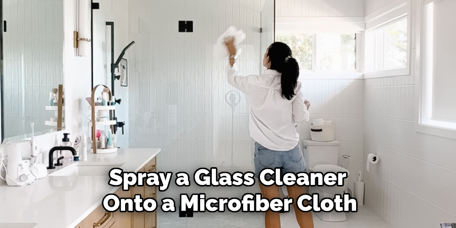 Spray a Glass Cleaner 
Onto a Microfiber Cloth