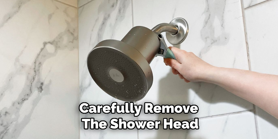 Carefully Remove the Shower Head